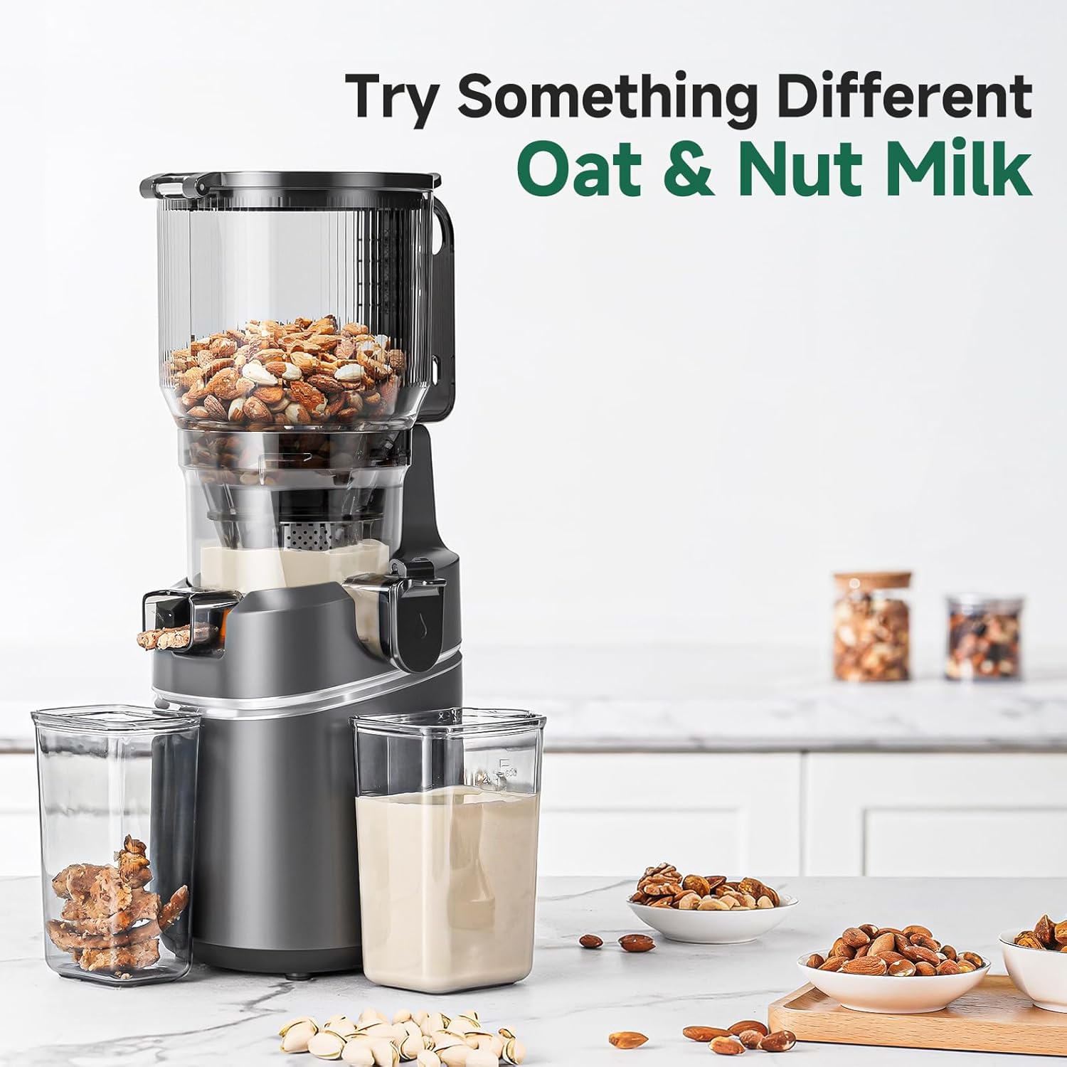 Nut milk maker with ingredients and oat and nut milk on a kitchen counter.